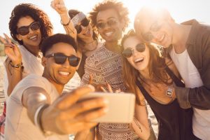 Group of friends taking selfie video